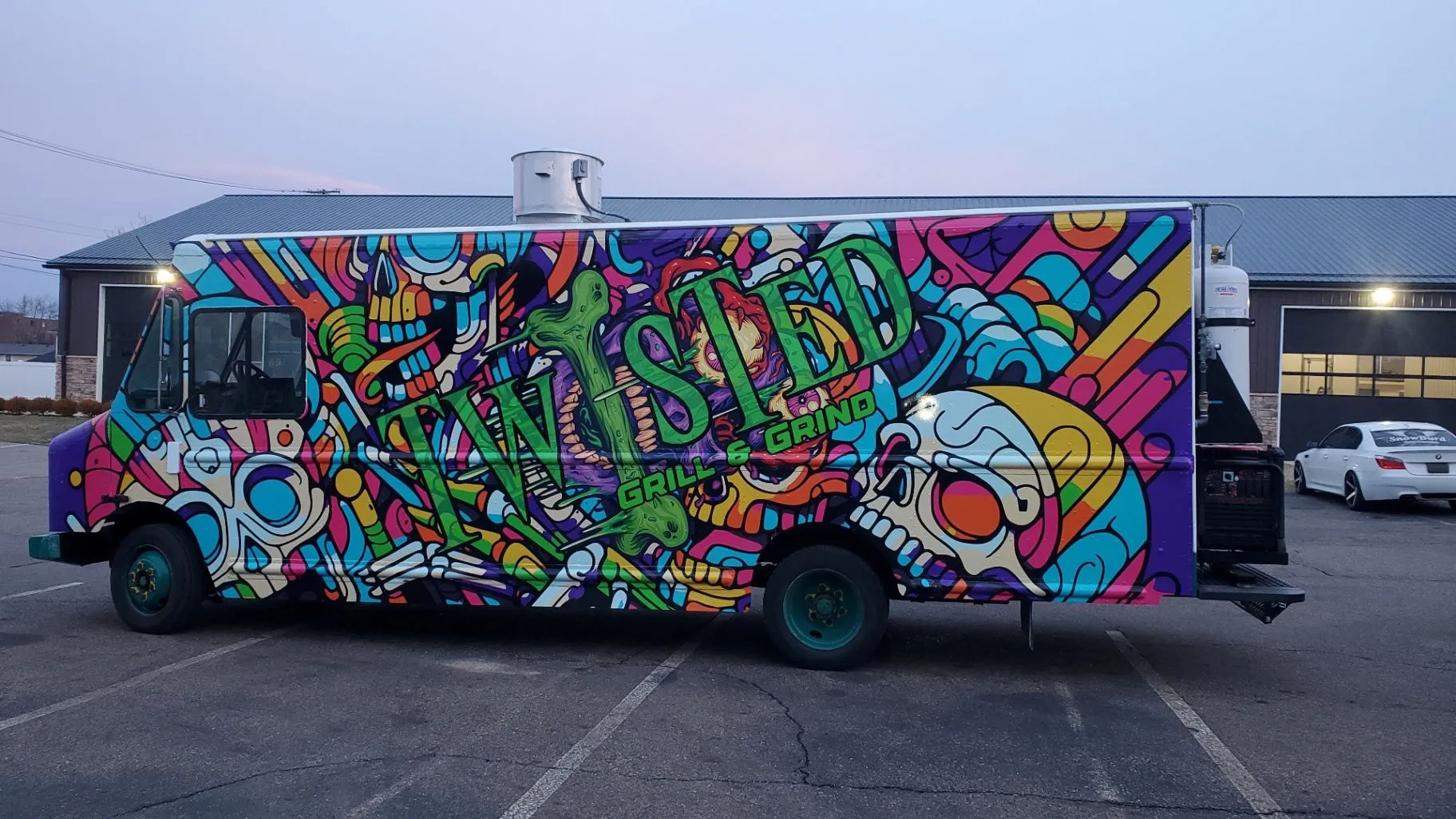 Colorful custom graphics covering a food trailer wrap