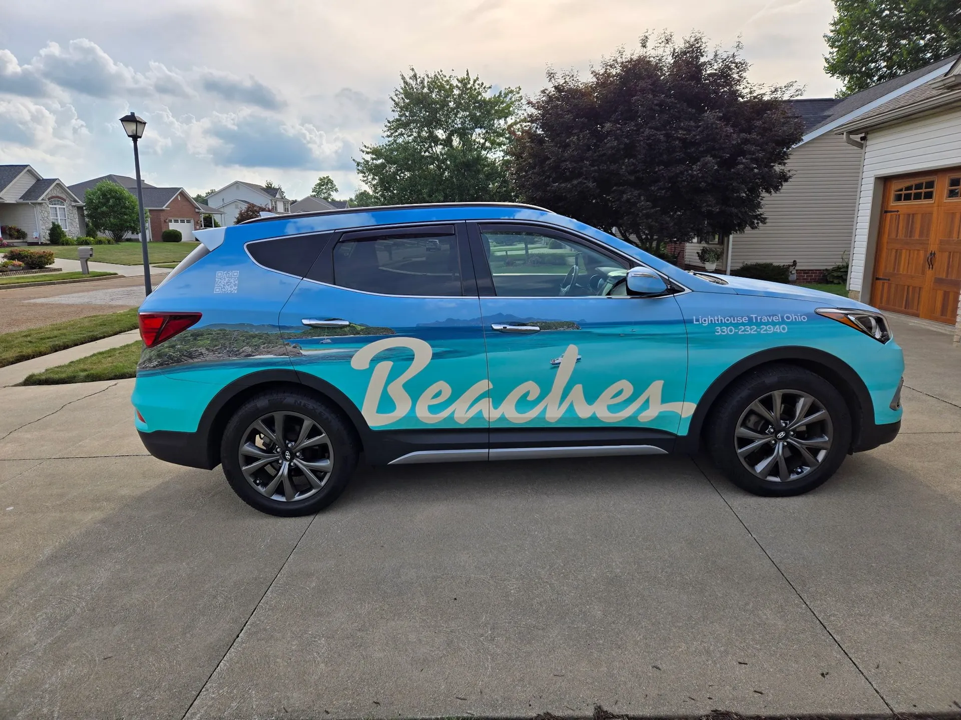 Blue vehicle with a custom printed wrap for an Ohio business